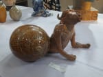 A ceramic sculpture of a snail with a human head and a buffalo body by Sayan Basu Nandan Mela 2024